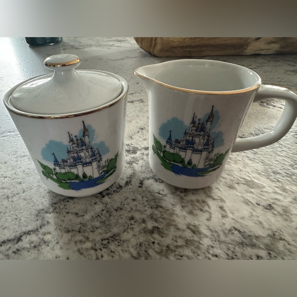 A vintage Walt Disney World Cinderella Castle sugar bowl and creamer.